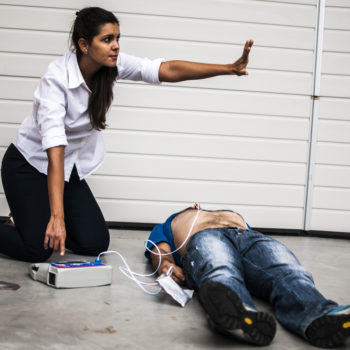 woman implementing AED