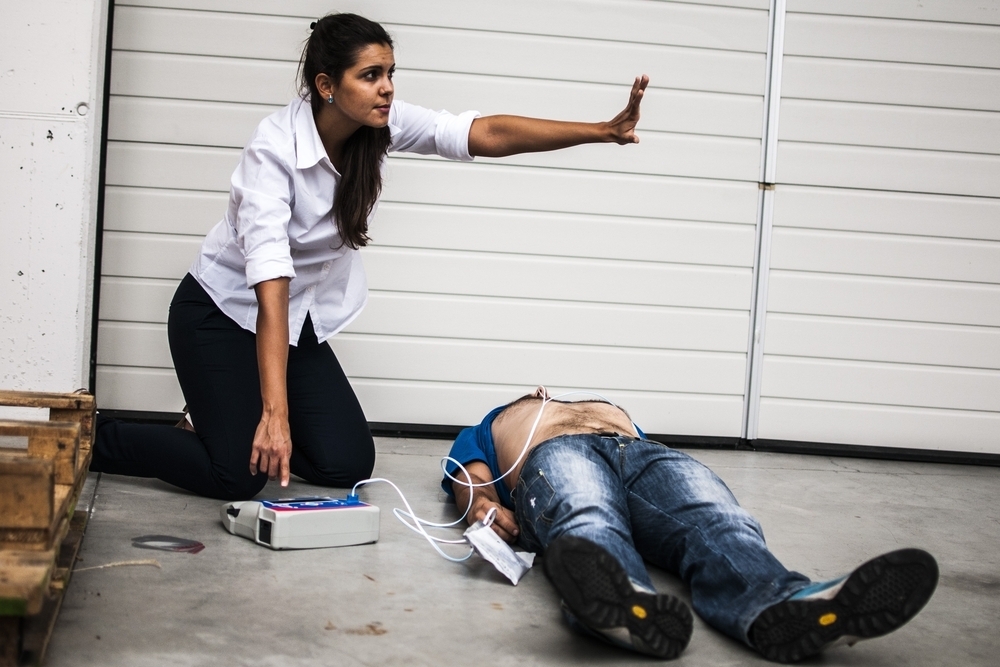 woman implementing AED