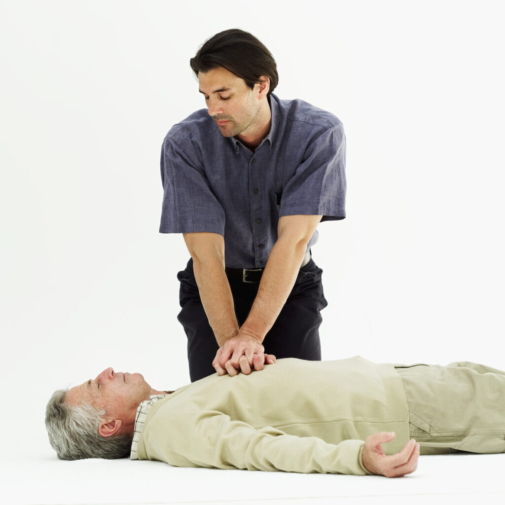 Man doing chest compressions